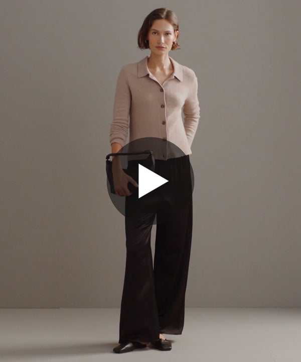 Model walking in-studio wearing Demi Pants in Black.